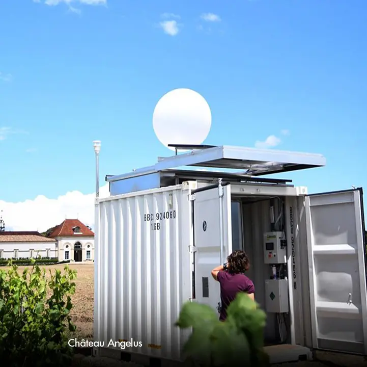 Cloud seeding balloon by Selerys launching from its launcher station in a vineyard